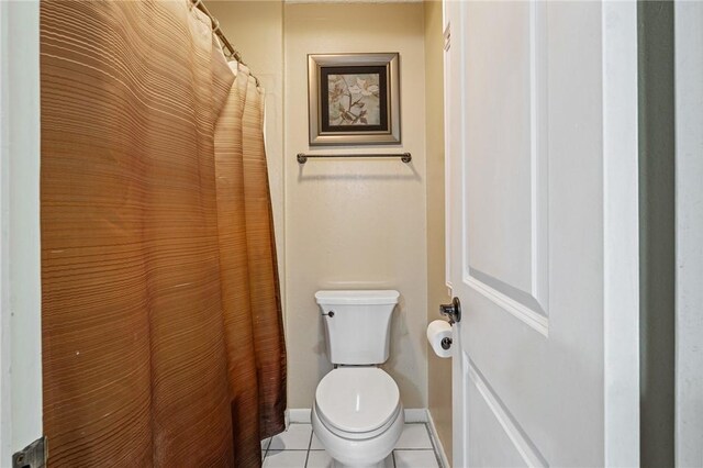 11805 Night Hawk, Corpus Christi, TX 78410 - bathroom with toilet, tile patterned flooring, baseboards, and a shower with curtain