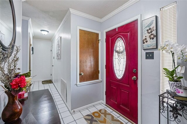 11805 Night Hawk, Corpus Christi, TX 78410 - foyer featuring light tile patterned floors, crown molding, and baseboards
