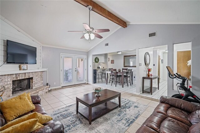 11805 Night Hawk, Corpus Christi, TX 78410 - living room featuring ceiling fan, tile patterned floors, beamed ceiling, high vaulted ceiling, and a fireplace