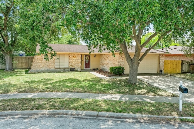 11805 Night Hawk, Corpus Christi, TX 78410 - view of front of home with brick siding, an attached garage, and driveway