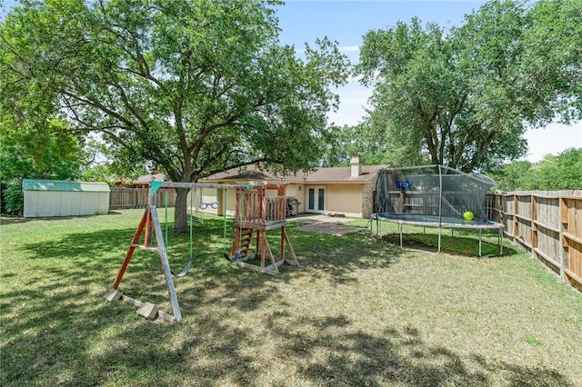 11805 Night Hawk, Corpus Christi, TX 78410 - back of house featuring a trampoline, french doors, a playground, and a chimney