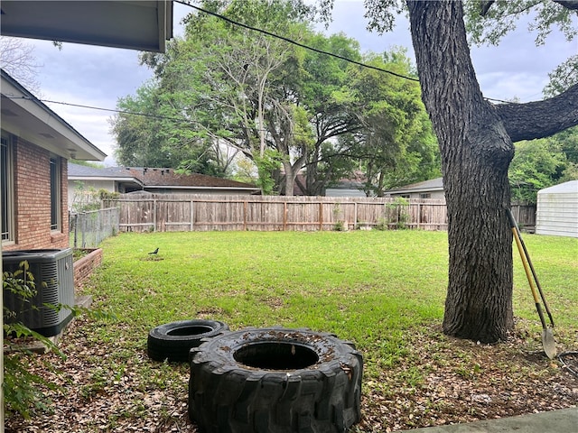 view of yard featuring central AC