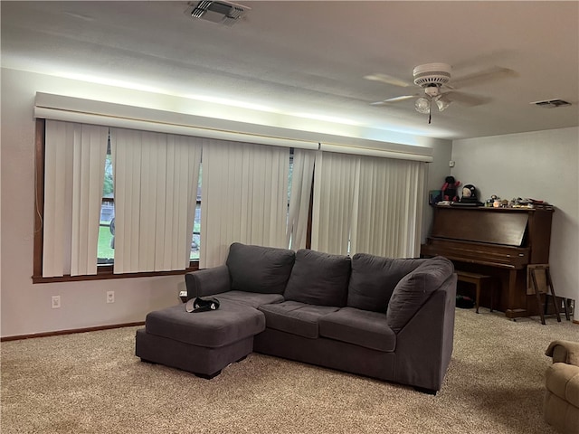 living room featuring carpet flooring and ceiling fan