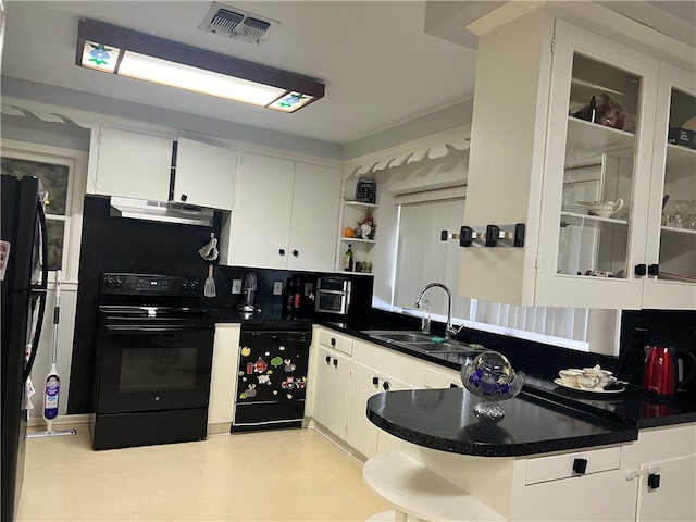 kitchen with white cabinets, sink, black electric range, and tasteful backsplash