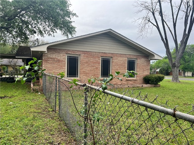 view of property exterior with a yard