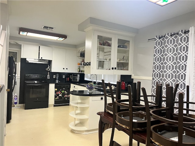 kitchen featuring extractor fan, sink, white cabinets, beverage cooler, and electric range