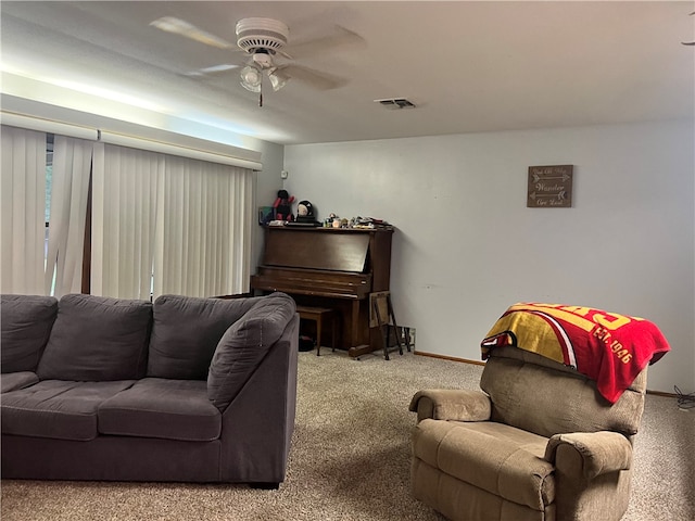 living room with ceiling fan and light colored carpet