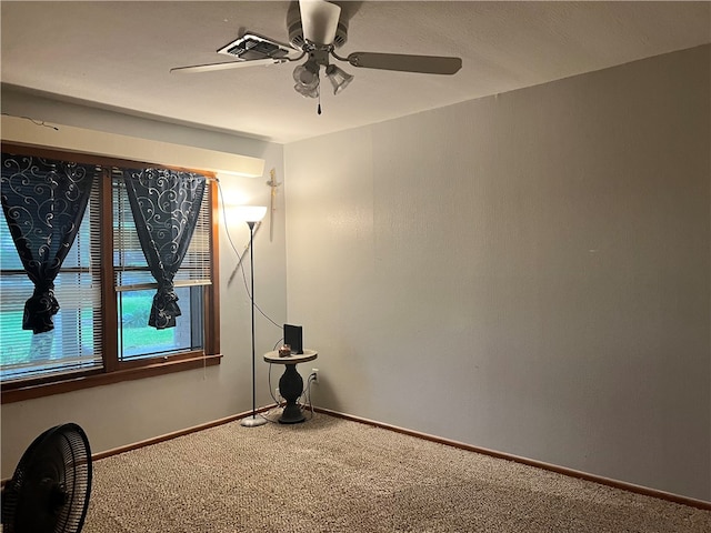 empty room with carpet flooring and ceiling fan