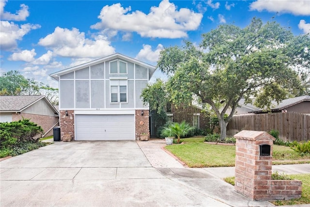 view of front of house with a front lawn and a garage