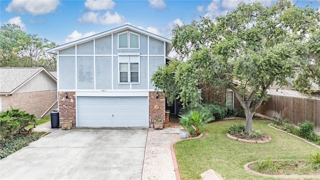 view of front of home with a front yard and a garage