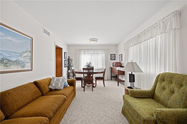 living room with carpet floors and visible vents