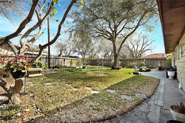 view of yard with a fenced backyard