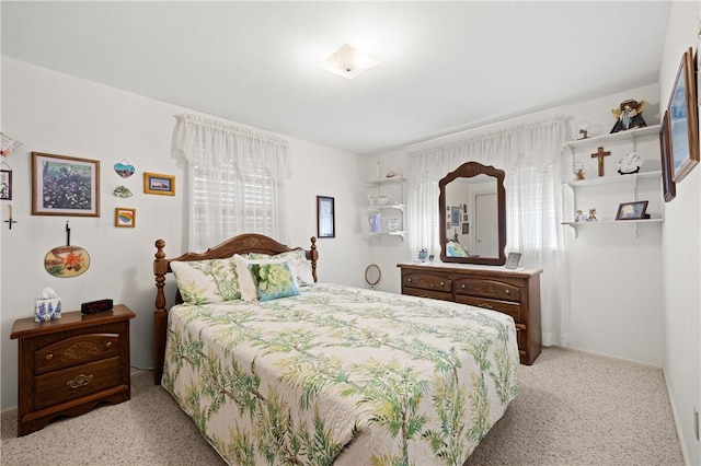 bedroom with light carpet