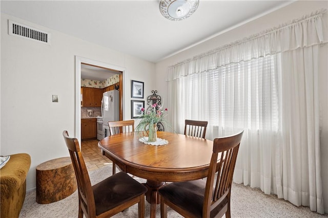 dining area featuring visible vents