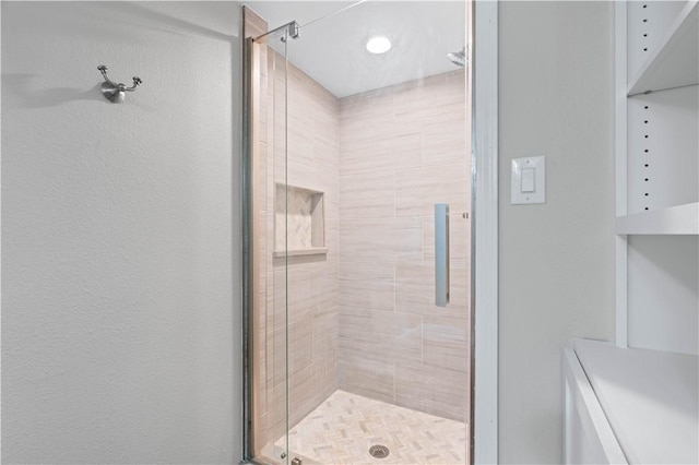 bathroom with a shower stall
