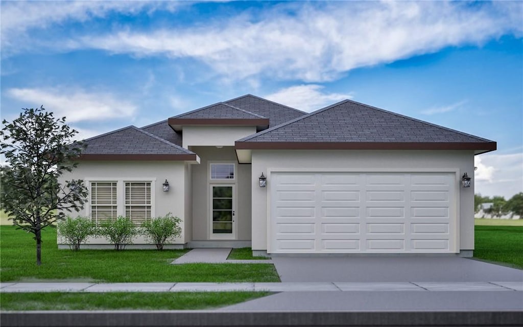 view of front of house with a garage and a front lawn