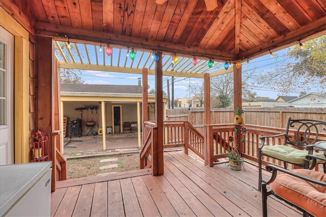 wooden deck featuring a pergola