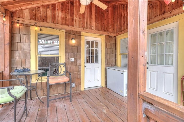 interior space with vaulted ceiling and ceiling fan