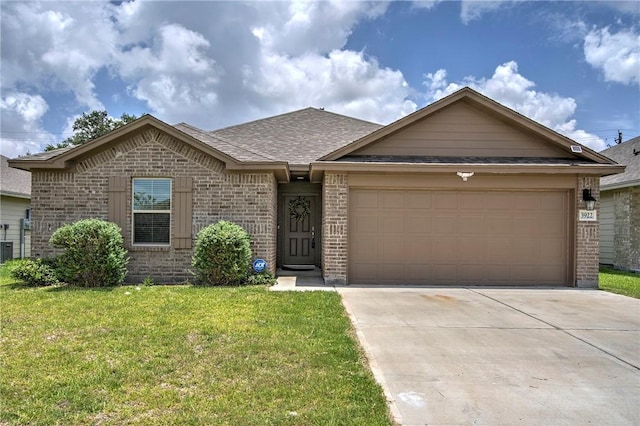 3922 Jayden Dr, Corpus Christi, TX 78410 - ranch-style house with brick siding, a front lawn, driveway, a garage, and a shingled roof