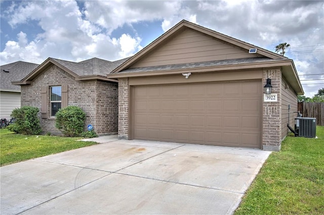 3922 Jayden Dr, Corpus Christi, TX 78410 - single story home with brick siding, concrete driveway, a front yard, an attached garage, and a shingled roof