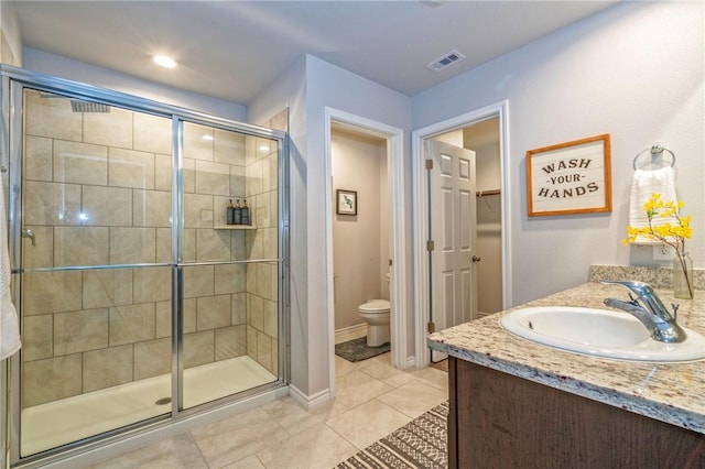3922 Jayden Dr, Corpus Christi, TX 78410 - bathroom featuring a shower stall, vanity, tile patterned floors, and a spacious closet