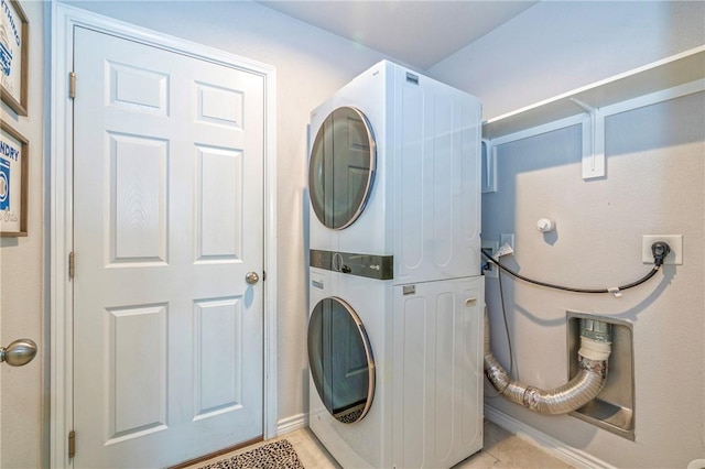 3922 Jayden Dr, Corpus Christi, TX 78410 - washroom featuring stacked washer and clothes dryer and light tile patterned floors