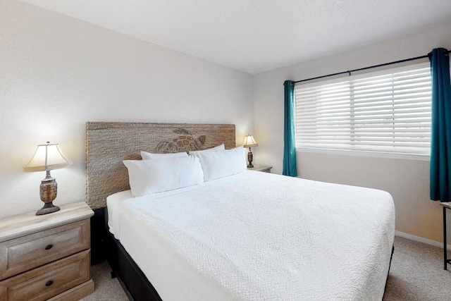 bedroom featuring light carpet