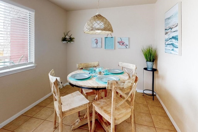 dining area featuring light tile patterned floors