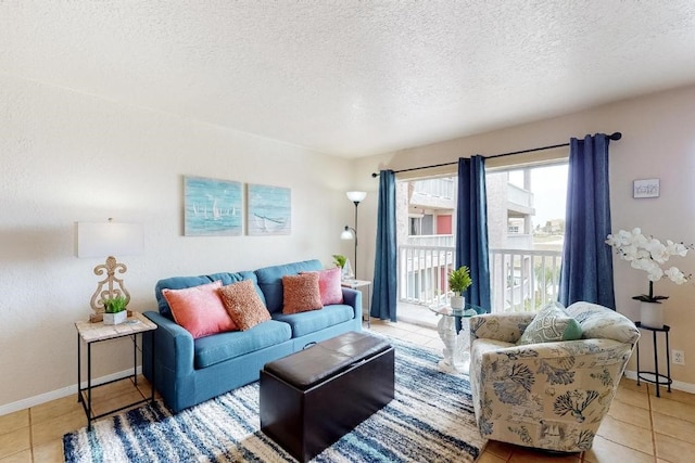 living room featuring light tile patterned floors and a textured ceiling