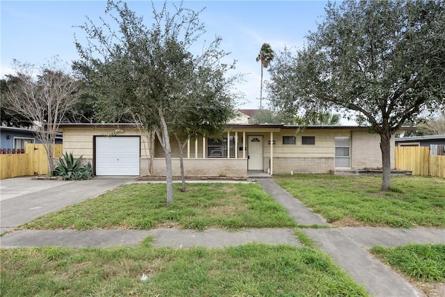 ranch-style house featuring driveway, brick siding, an attached garage, and fence