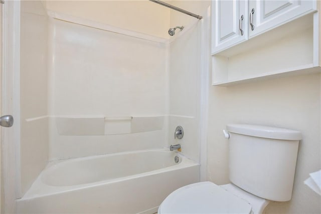 bathroom featuring toilet and bathing tub / shower combination