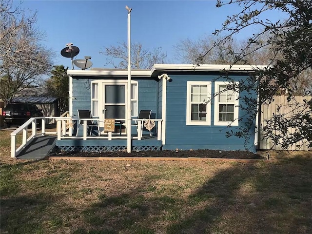 back of house with a yard