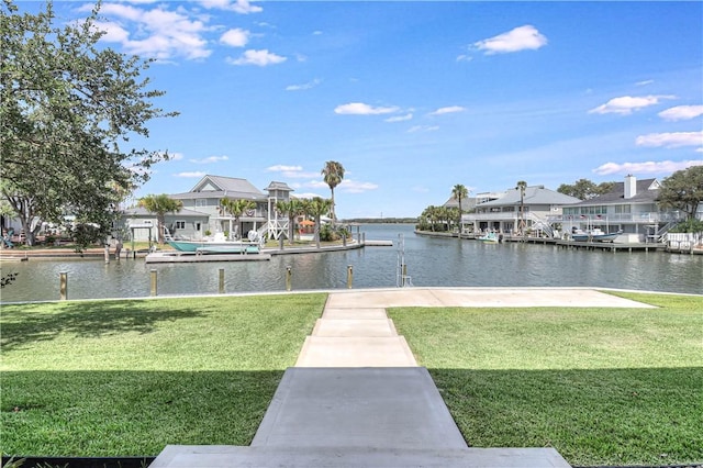 dock area featuring a water view and a lawn