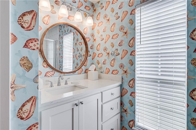 bathroom with vanity and a shower