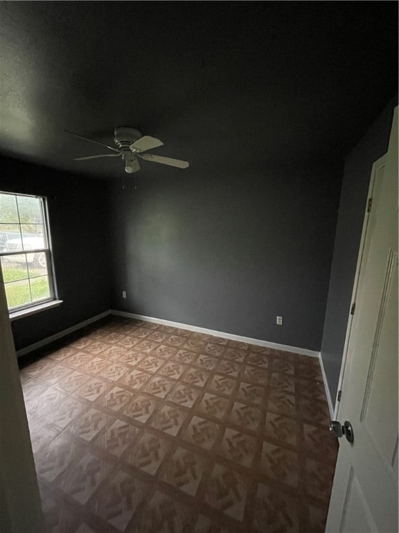 spare room with ceiling fan