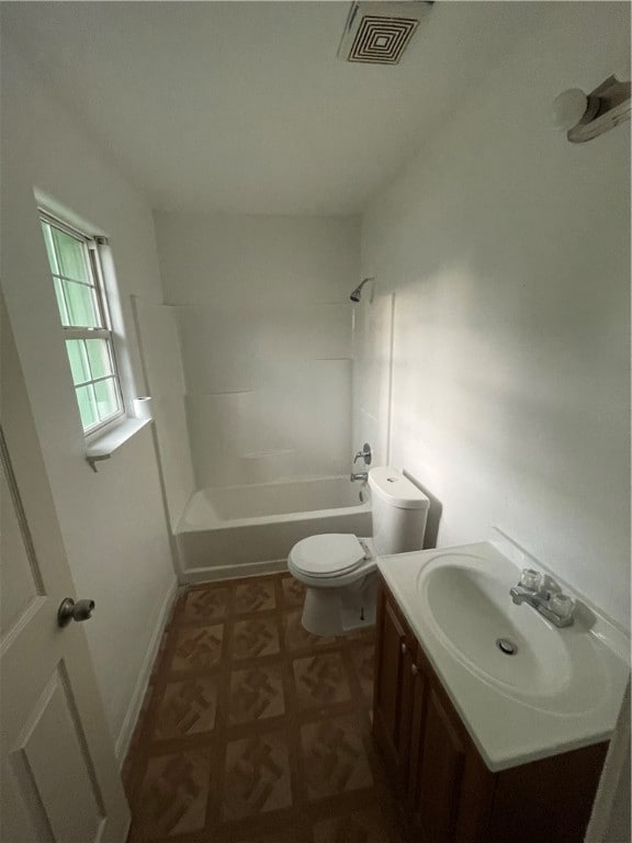 full bathroom featuring washtub / shower combination, toilet, and vanity