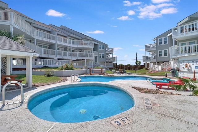 view of swimming pool featuring a patio area