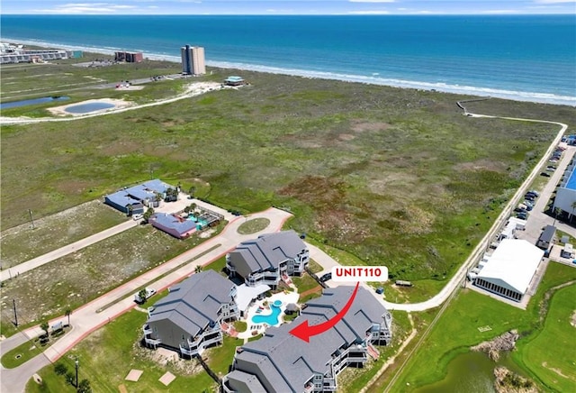 aerial view featuring a water view and a beach view