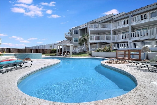 view of pool with a gazebo and a patio