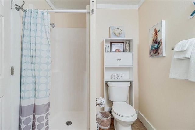 bathroom with walk in shower, tile patterned floors, and toilet