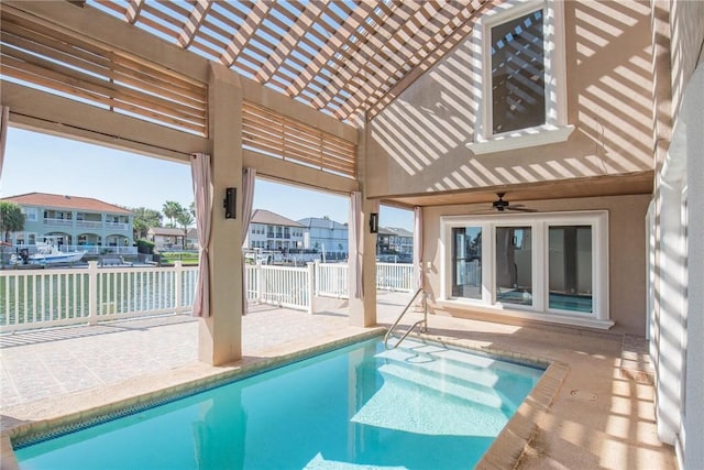 view of swimming pool featuring a patio area, ceiling fan, and a pergola