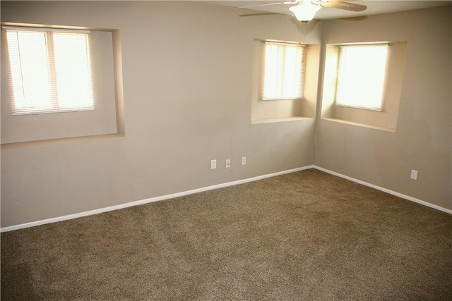 empty room featuring ceiling fan and carpet floors