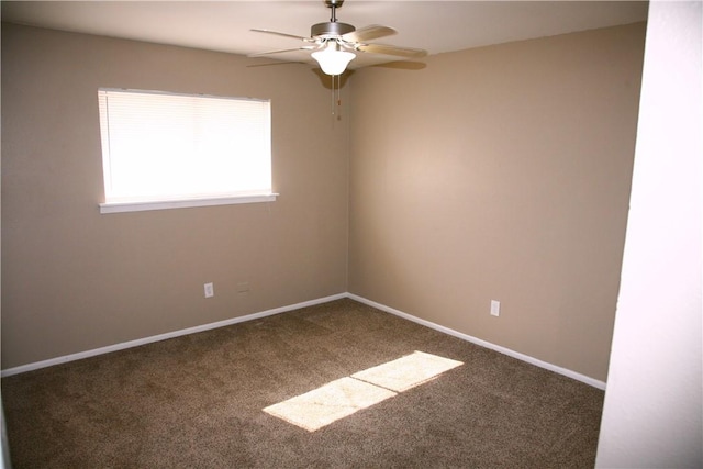 spare room featuring carpet flooring and ceiling fan