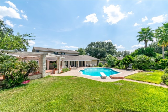 view of pool featuring a diving board, a lawn, a pergola, and a patio area