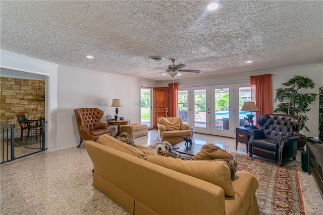 living room with ceiling fan, french doors, crown molding, and a textured ceiling