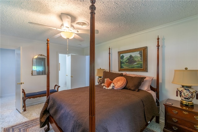 bedroom with a textured ceiling, light carpet, ceiling fan, and crown molding