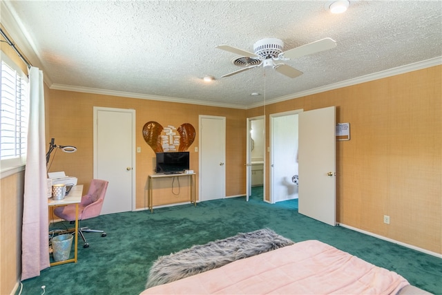 carpeted bedroom featuring a textured ceiling, ceiling fan, and crown molding