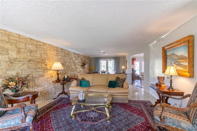 living room featuring a textured ceiling and ornamental molding