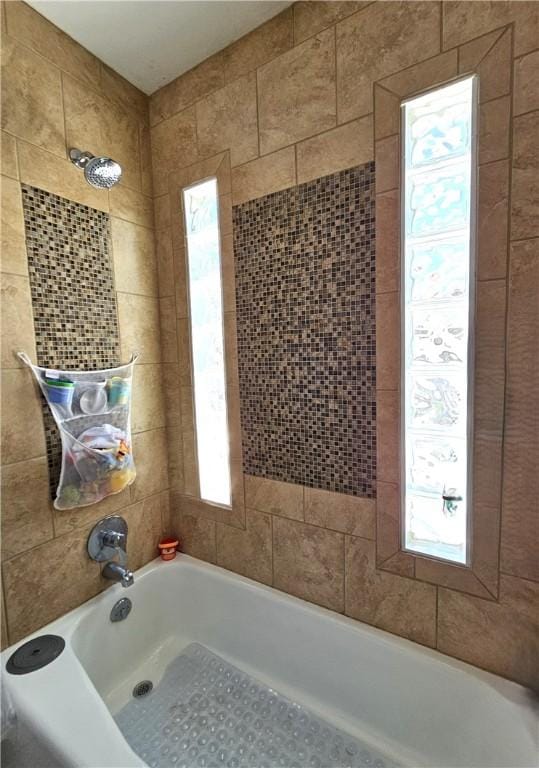 full bath featuring a tub to relax in and walk in shower