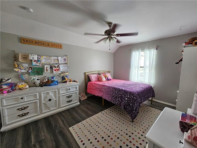 bedroom with lofted ceiling, wood finished floors, a ceiling fan, and baseboards